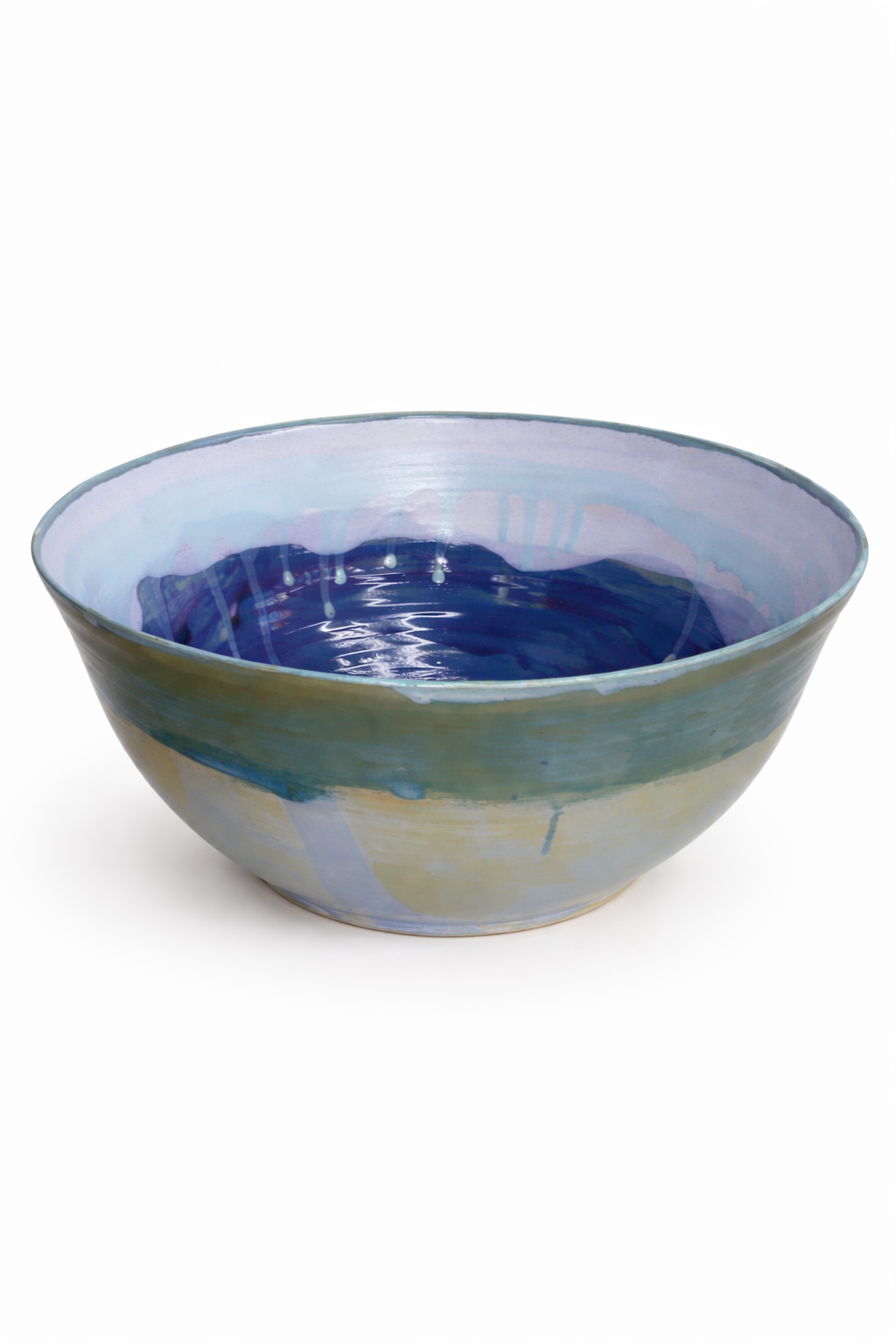 Bol en céramique avec un intérieur bleu et des motifs de couleurs douces